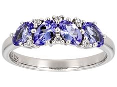 .74ctw Oval Tanzanite With .05ctw Round White Zircon Rhodium Over Sterling Silver Ring. Measures approximately .67"L x .22"W. Not sizeable. Accent stones primarily zircon. Tanzanite Rings With Diamond Accents In Round Cut, Tanzanite Rings With Diamond Accents Round Cut, Anniversary Round Cut Gemstones With Diamond Accents, Country Rings, Tanzanite Gemstone, Blue Tanzanite, Broken Chain, Cultured Pearls, Gemstone Colors