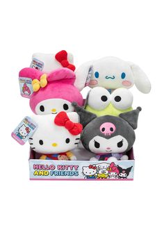 three hello kitty stuffed animals in a box