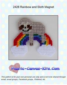 a white bear with a rainbow on it's back and the text below reads, 428 rainbow and sloth magnet