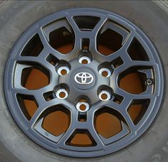 the front wheel of a car with four spokes