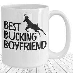 a white coffee mug with the words best bucking boyfriend printed in black on it