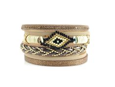 ☮ Get a layered look with one easy to put on bracelet. Bracelet consists of 6 different and beautiful leather layers and features a hand woven Miyuki beaded evil eye. Bracelet fastens with a strong and easy to close gold alloy magnetic clasp. ☮ Bracelets measures 7 1/4 inches long and about 1 1/2 inches wide. Bracelet fits a wrist up to 7 inches around. ☮ Bracelets are ready to ship ☮ Link to red bracelet: https://www.etsy.com/listing/812026710/leather-wrap-bracelet-leather-cuff?ref=shop_home_ac Adjustable Brown Bracelets For Party, Adjustable Brown Wrap Bracelet For Party, Adjustable Beige Bangle Bracelet, Gold Leather Bracelet, Beaded Evil Eye, Layered Bracelet, Red Bracelet, Black Beaded Bracelets, Double Wrap Bracelet