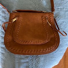 Medium Crossbody Bag. Tan. New, Never Used. Zipper Pocket In Back. Magnetic Clasp In Front. Brown Crossbody Saddle Bag For Errands, Brown Crossbody Saddle Bag With Zipper, Brown Crossbody Satchel With Zipper Closure, Brown Satchel With Zipper Pocket For Errands, Dark Tan Crossbody Shoulder Bag, Brown Crossbody Saddle Bag With Cell Phone Pocket, Brown Satchel With Zipper Pocket For Fall, Medium Crossbody Bag, Magnetic Clasp