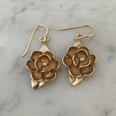 Our state flower! Measures approximately 1" tall and 3/4" wide. Each magnolia hangs from gold filled or sterling silver ear wires. Each piece varies slightly due to its handmade nature.Hand made in our south Louisiana studio. Cake Pull Charms, Butter Shrimp, Customizable Jewelry, South Louisiana, Wax Carving, Bronze Earrings, Bronze Jewelry, Louisiana State, Artist Gifts