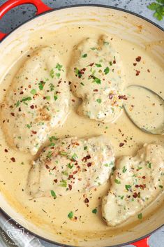 chicken with gravy in a skillet on the stove