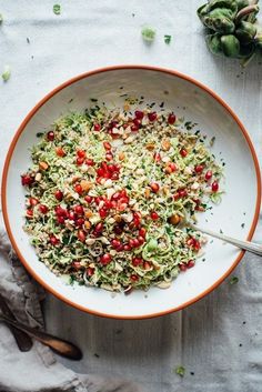 a white bowl filled with shredded vegetables on top of a table