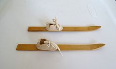 two pairs of wooden skis with shoes on them