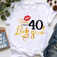 a t - shirt that says damn i make 42 look good with lipstick on it