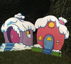 there are two little houses that look like they have snow on them