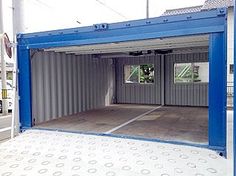 a large blue container sitting in the middle of a parking lot