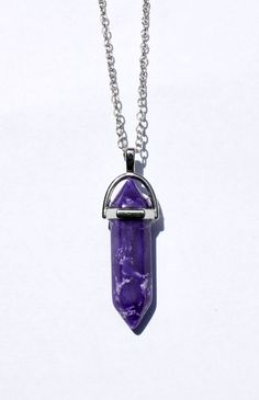 This is a Purple Hexagon healing crystal for every occasion.  Each Natural Gemstone has its unique pattern, and shape.  It is a shape of a hexagon to release energy on each corner.  These crystal has a mysterious shape that adds mysticism to any outfit. * Includes 18 inches chain. * Silver plated holder * 3.8cm in length, and 8mm wide. * Natural Crystal It is intended to reflect negative energy.  The hexagon has six sides which is the number of love.  Each pyramid reflects love on both sides.  All the negative energy released by beings who hate gets reflected back to them or to the universe. Do not allow anyone to touch it, because it may get charged with negative energy.   There are plenty of people who may feel like touching it, but keep a distance.   It is a special gemstone.   One of m Adjustable Purple Crystal Necklace, Release Energy, Chain Silver, Chakra Crystals, Crystal Stone, Healing Crystal, Negative Energy, Crystal Pendant, Natural Crystals