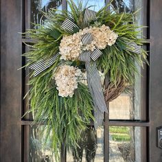 a wreath is hanging on the front door