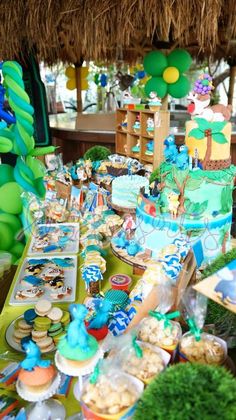 a table filled with lots of food and decorations