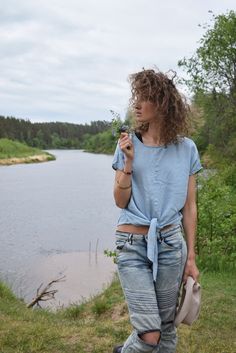 "Excellent denim blouse for your midsummer nights. It is not a mistake - buttons are on the back! Size: label says S, seems like women's (S) MEASUREMENTS: Length: 57 cm/ 22\" (without ties) Shoulder to shoulder: 50 cm/ 20\" Chest: 116 cm/ 46\" Condition: excellent Fabric: Lyocell Brand: unknown * Wash at temperature not higher than 30oC / 86oF Model wears: UK 8/ EU 36/ US 4 Model's height: 175 cm/5'7\" You can find more similar shirts here: https://www.etsy.com/shop/OnTheRoadStore?section_id=239 Short Sleeve Denim Top For Summer, Summer Denim Blue Top With Short Sleeves, Light Indigo Short Sleeve Denim Top For Summer, Denim Beach Top With Short Sleeves, Beach Denim Short Sleeve Top, Light Wash Short Sleeve Denim Top For Summer, Summer Chambray Denim Shirt, Casual Denim Blue Summer Shirt, Trendy Light Wash Denim Blouse