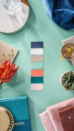 the table is covered with different shades of blue and pink, along with other items