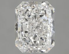 a cushion cut diamond on a gray background with the center stone in the shape of a square