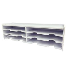 a white shelf that has several compartments on each side and one section with dividers