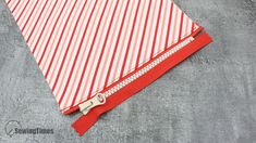 red and white striped fabric with zipper