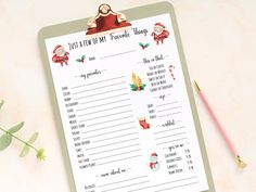 a printable christmas wish list on a clipboard next to a pencil and plant