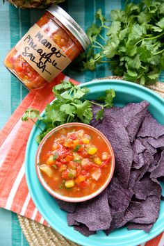 a blue plate topped with chips and salsa