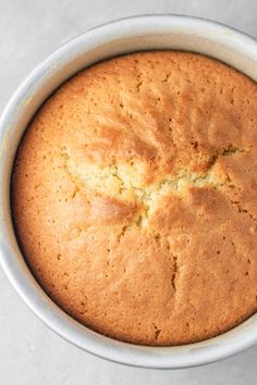 a loaf of bread in a white bowl