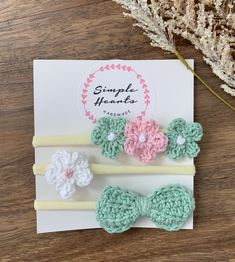 This is a super pretty set of three baby   headbands Hand crocheted in pretty cotton yarn. a classic bow plus a set of three pretty flowers and a sweet single white with pink centre. A sweet  addition to any little ones outfit.  They are attached to a super soft and stretchy headband . To fit newborn up to toddler.  Perfect little gift for a newbaby or baby shower or for your own little one. Bandeau Au Crochet, Crochet Bows, Third Baby, Stretchy Headbands, Cute Bow, Crochet Headband, Cotton Crochet, Cute Bows