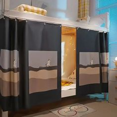 a bathroom with two shower curtains on the wall