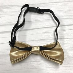 "Adults/Teens Elastic Suspender, Bow-tie All dimensions are approximate only Suspender Dimensions: Wide : 1\" (2.5cm) Adjustable from 25\" 63.5cm - 38\" (96.52cm) Bow Tie Dimensions: Length: 12cm (4.7 inches) Height (Widest Point): 6cm (2.36 inches) Height (Narrowest Point): 2.3cm (0.90 inches) Length of Bow Tie Strap at full length: 48cm (18.89 inches)" Gold Bowtie, Navy Blue Suspenders, Blue Suspenders, Face Shield Masks, Wear Red Lipstick, Father Son, Champagne Gold, Father And Son, Matching Sets