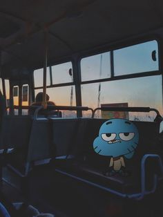 the inside of a bus with cartoon characters on it and people looking out the window