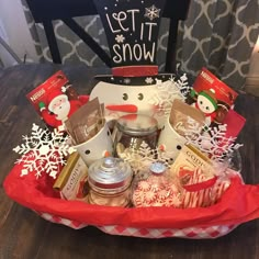 a snowman gift basket filled with holiday treats and gifts for someone's special occasion