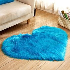 a bright blue rug in the middle of a living room