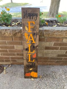 a wooden sign that says happy fall y'all