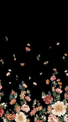 a black background with flowers and butterflies flying in the air on top of each other