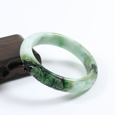 56mm Certified A Natural Green Carving Burma Jadeite Jade Bangle Bracelet 4873   Inside diameter * Width : 55.6 * 12.9 mm Weight : 53.83 g Density : 3.33 g/cm³ Payment:     We accept PayPal only, please confirm your address on eBay before you pay for your item, and we only ship to the address you left on eBay, hope you can understand.     If you had any question, please contact us via eBay message, we will respond you ASAP. Return Policy:     We offer a 14 days money-back guarantee.     If you decide to return it, please contact us and send it back within 30 days after receipt, in its original condition (including the packing materials) Thank you very much, hope you can have a nice shopping expericece. Payment Payment  WELCOME&FEEDBACK RATING: Hi my friend,we serve customer wholeheartedly Green Carved Bracelet As A Gift, Green Carved Bracelet For Gift, Green Carved Bracelets As Gift, Green Spiritual Bangle As A Gift, Spiritual Green Bangle As A Gift, Carved Jade Bangle As A Gift, Adjustable Green Jade Bangle, Green Carved Bangle Bracelet, Green Carved Bangle Bracelets