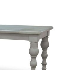 a gray table with two legs and a white top