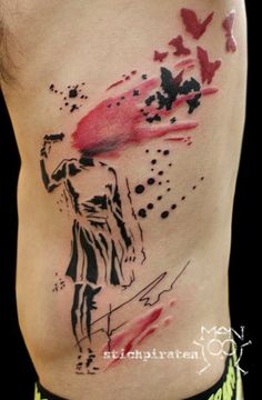 a man's lower back with watercolor tattoos on his body and the image of a woman holding a red umbrella