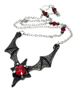 Made to Order! Dramatic, imposing and vampiric as you are, this bat wing necklace will complete your nocturnal ensemble. Stalk the halls of your dwelling or favorite events and capture the attention of your fellow night creatures with its unique design, sculpted in our studio. The pendant is cast in lead free pewter by Night Creatures, Outfit Choices, Goth Necklace, Goth Jewelry, Bat Wing, Creatures Of The Night, Wing Necklace, Rosary Chain, Cabochons Stones