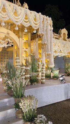 an elaborately decorated stage set up for a wedding