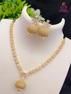 Another exclusive American diamond jhumka necklace earrings design from Indian Designs. Bridal Jewelry Sets Brides, Indian Wedding Jewelry Sets, Emerald Necklace Pendant, Silver Bridal Earrings, Pure Gold Jewellery, American Diamond Jewellery, American Diamond Necklaces, Bridal Bangles, Diamond Jewelry Necklace