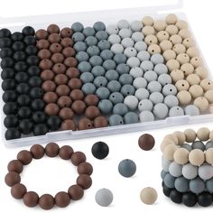 the beads are arranged in different colors and sizes, including black, white, brown, and grey