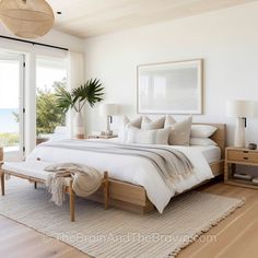 a bedroom with a large bed sitting next to a sliding glass door that leads to an outside deck