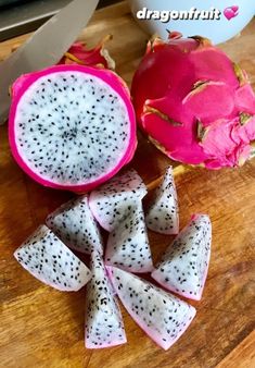 dragon fruit cut in half on a cutting board