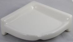 a white square dish sitting on top of a table