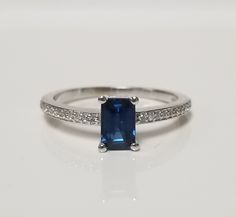 "Thanks for shopping our vintage estate store. We tend to sell well below wholesale and truly hope you enjoy all of our items. Many of the items are one of a kind, so please enjoy scrolling through the pictures and hopefully something will catch your eye. Vintage estate 10k white gold 1ct sapphire .02cts diamond ring. The sapphire is testing natural iolite, but looks created and there are 22 small diamonds. Beautiful ring, one that you will love. Marked 10k. Ring size: 6.75 Setting: 1/4\" 6mm by 1/4\" Band width: 2mm Weight: 2.09 grams Sapphire is a blue to cornflower blue in color emerald cut and diamonds are small, but nice and bright." Engagement Anniversary, Cornflower Blue, Beautiful Ring, Anniversary Ring, Emerald Cut, Anniversary Rings, Beautiful Rings, Diamond Engagement, Topaz