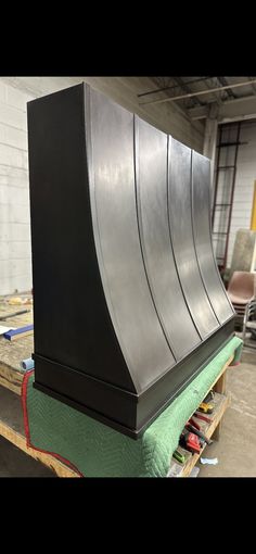 a large metal object sitting on top of a wooden pallet