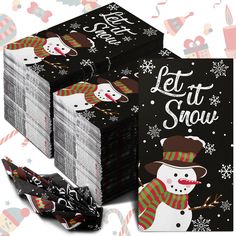 a pile of black and white paper with snowmen on it