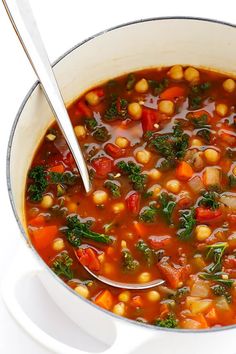 a white bowl filled with soup and vegetables