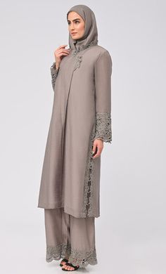 Organza designer loose palazzo kurta set. It is a detailed and intricate form of lace work on neck, sleeves and palazzo. It is a popular choice for special occasions, such as weddings and festivals. We will provide hijab matching with suit set Lace work detailing on V-neck and box pleate on front Fabric Details TOP Organza and white crepe lining Hijab 27 inch breadth and 70inch length Bottom Organza WASH: - First Time Dry Clean Notes:- Accessories are not included. Elegant Straight Kurta With Set-in Sleeves, Festive Palazzo Set With Set-in Sleeves For Eid, Eid Straight Kurta With Set-in Sleeves, Designer Long Sleeve Sets With Lace Work, Unstitched Elegant Salwar Kameez With Cutwork, Elegant Unstitched Salwar Kameez With Cutwork, Elegant Lace Salwar Kameez For Eid, Eid Long Sleeve Dresses With Set-in Sleeves, Elegant Festive Palazzo Set With Tunic