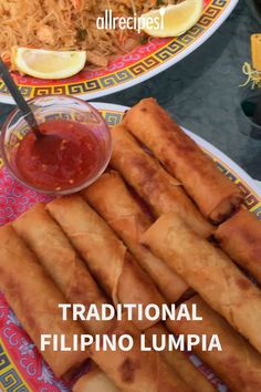 some food is sitting on a plate and next to a bowl with sauce in it