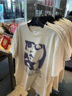 t - shirts on display in a clothing store